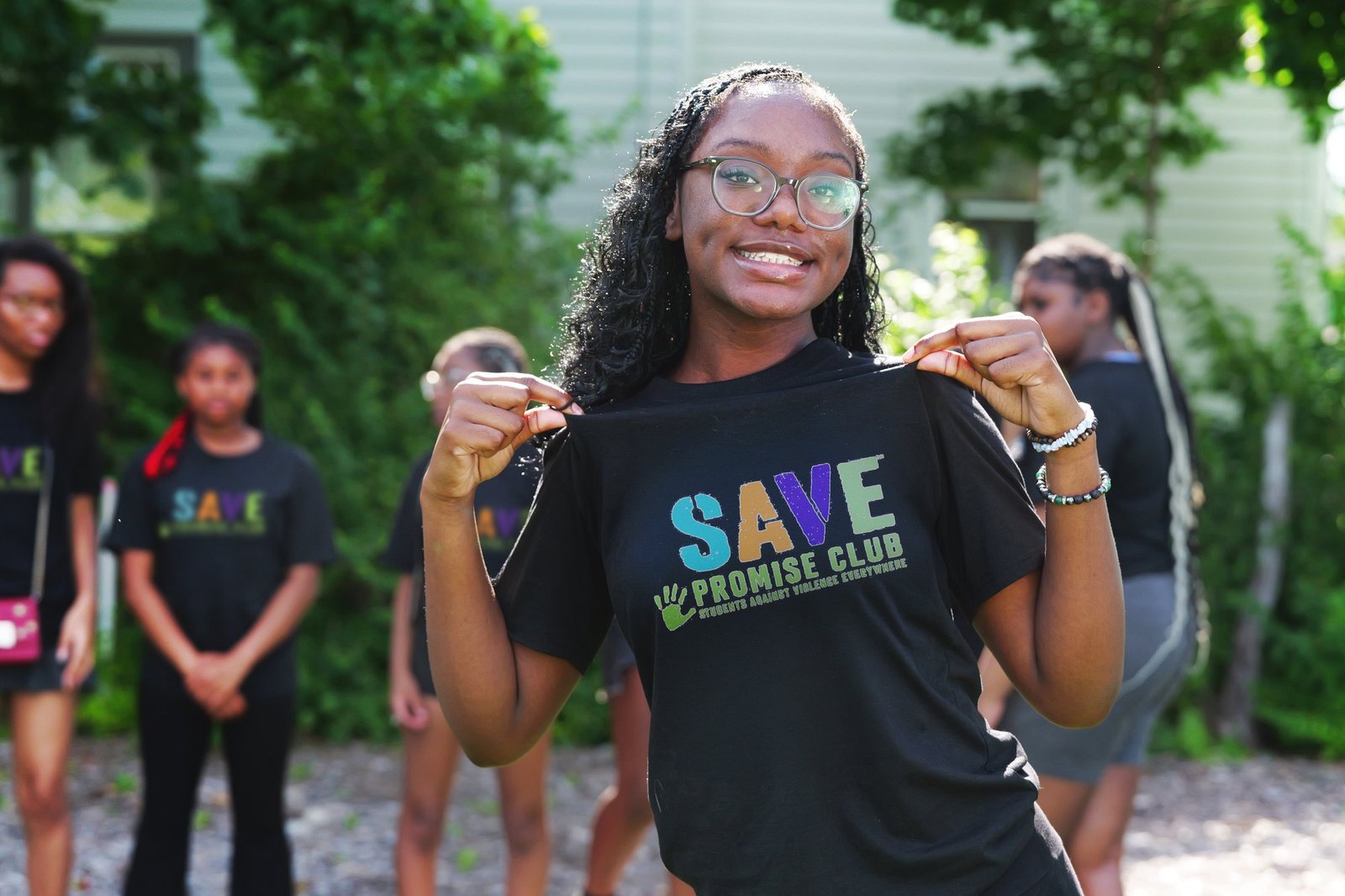 SAVE Fort Wayne member holding out her shirt
